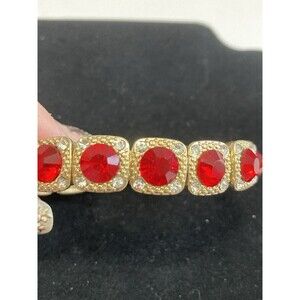 VINTAGE MONET RED AND CLEAR GLASS PANELED STRETCH GOLD TONE BRACELET
